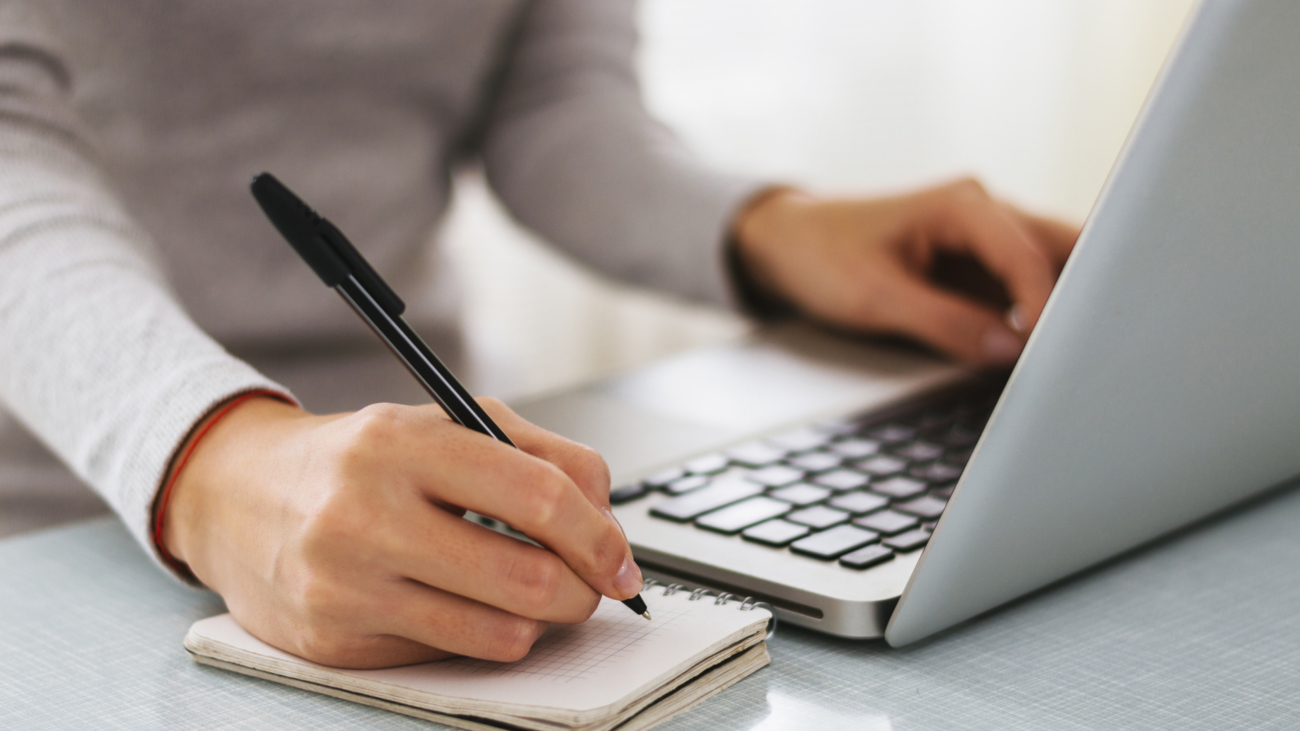 Businesswoman hand working with new modern computer and writing