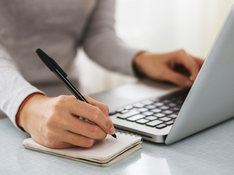 Businesswoman hand working with new modern computer and writing