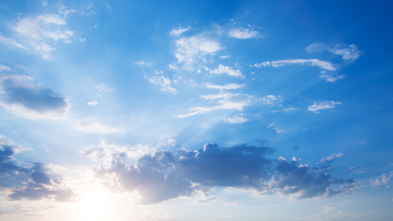 Large heavy clouds slowly float across the blue beautiful sky. Stunning landscape and view. Beautiful sky with cloud before sunset
